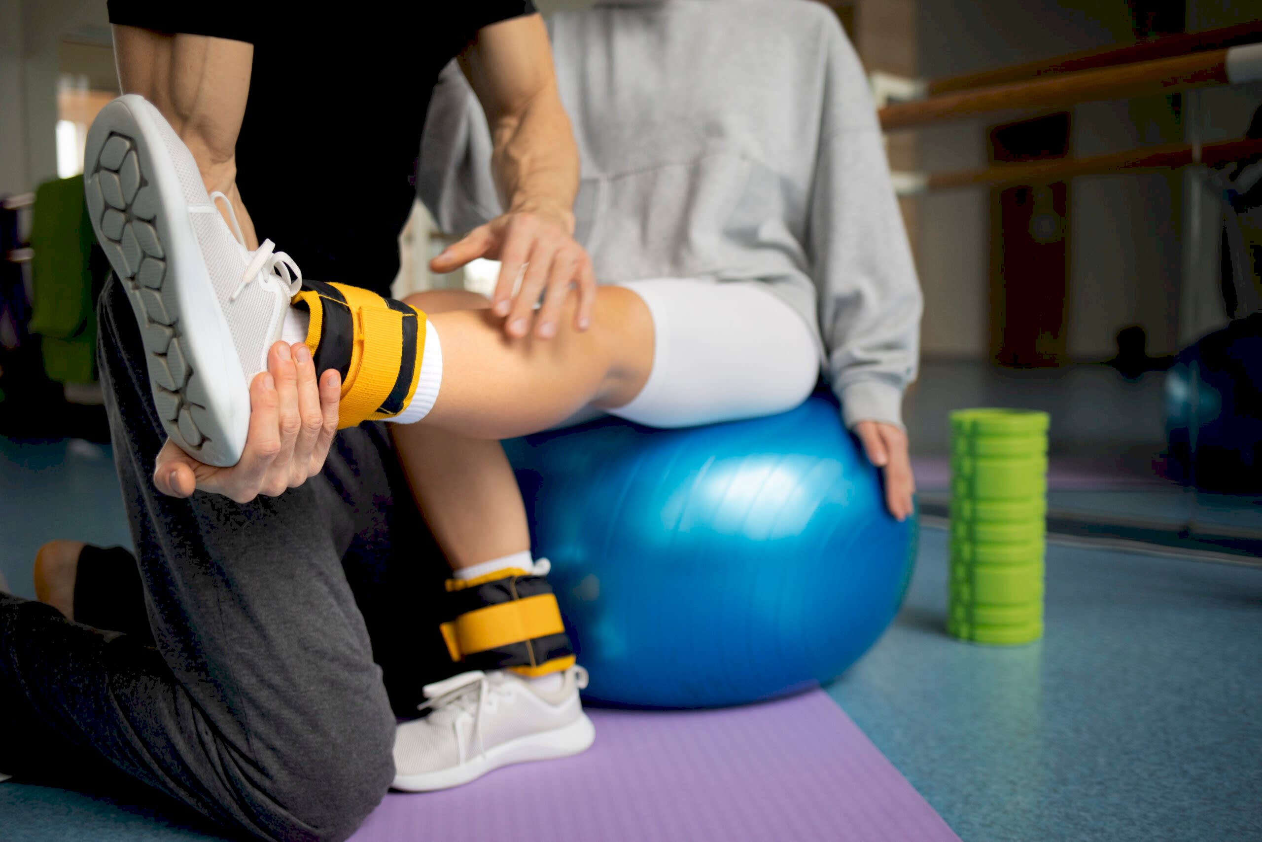 patient-doing-physical-rehabilitation-helped-by-therapists patient-doing-physical-rehabilitation-helped-by-therapists